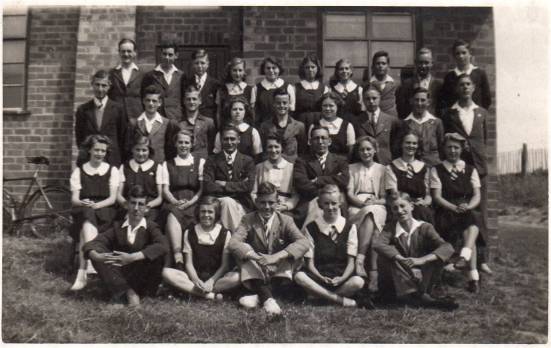 A postcard photograph of Betty's class, photographed outside St George's Halll in July 1940